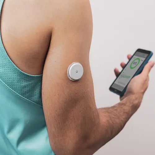 Man using continuous glucose monitor