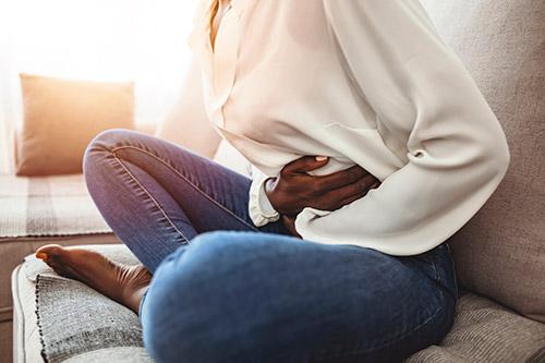 Woman with gut symptoms